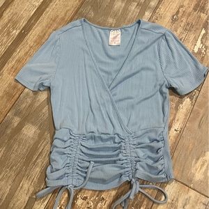 No Boundaries small blue top. With string ties and v-neck